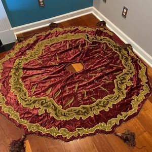 Velvet tasseled and beaded tree skirt from Neiman Marcus  the weight is 6.5lbs